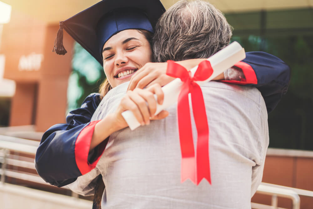 Parent hugging graduate